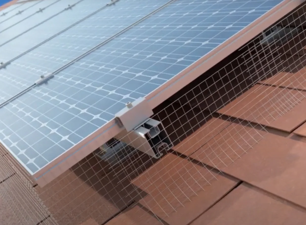 Solar panels installed on red tile roof