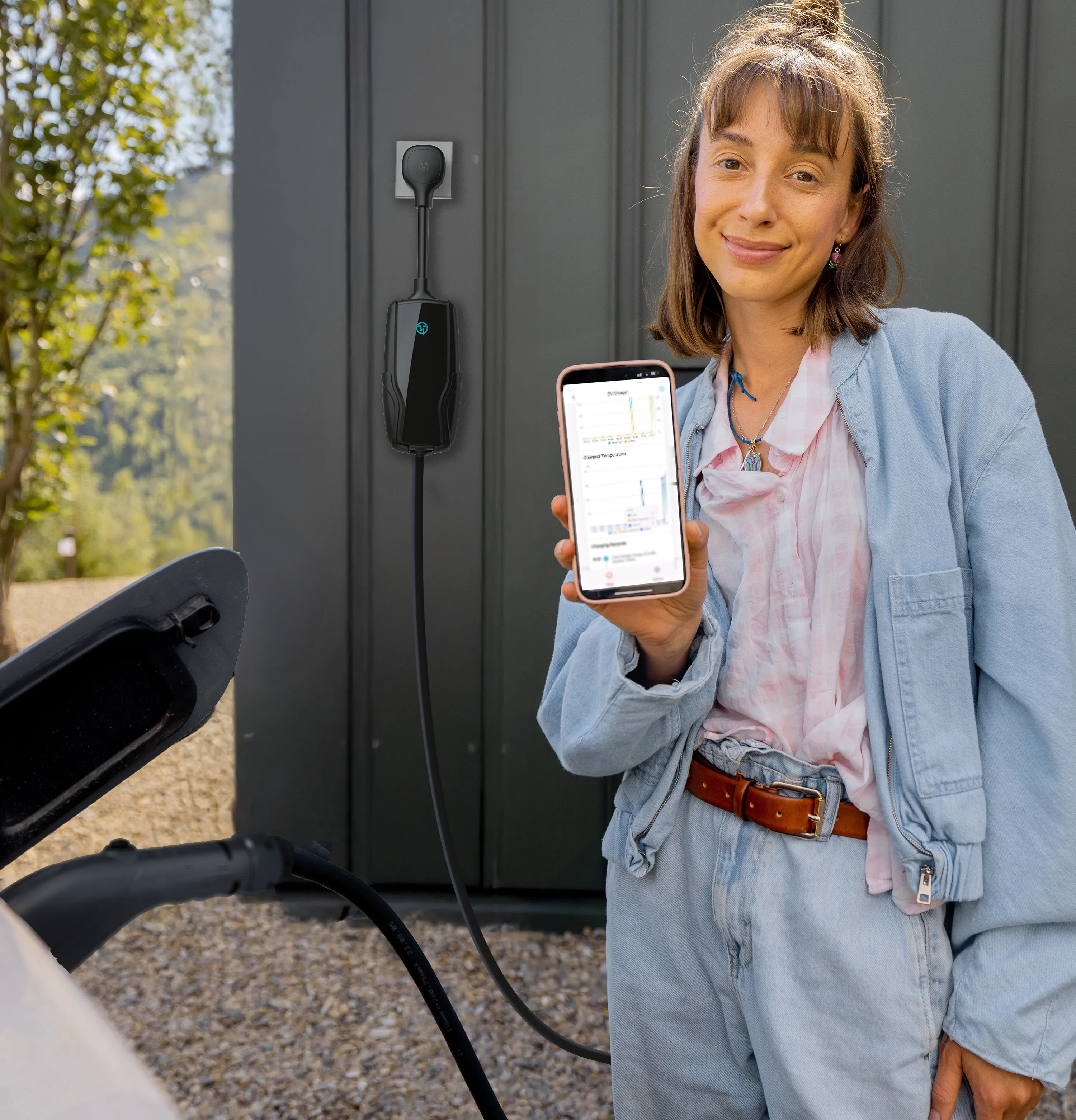 Woman using Pion Power app to monitor EV charging